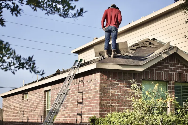 Professional roofer working on a residential roof in Glenview